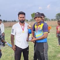 Balram and Vikas posing with the trophy